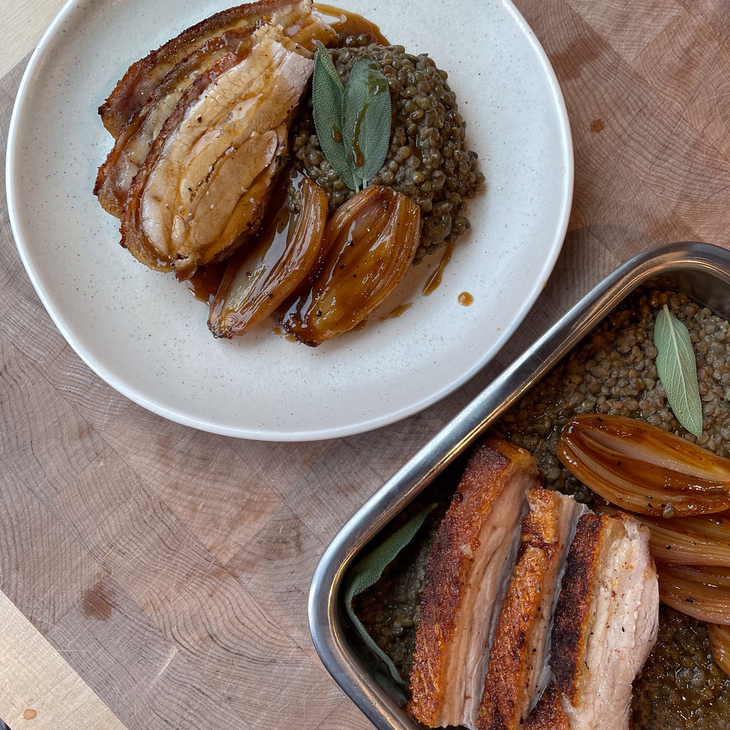 Roast pork belly, puy lentils & braised shallots by Barry Horne