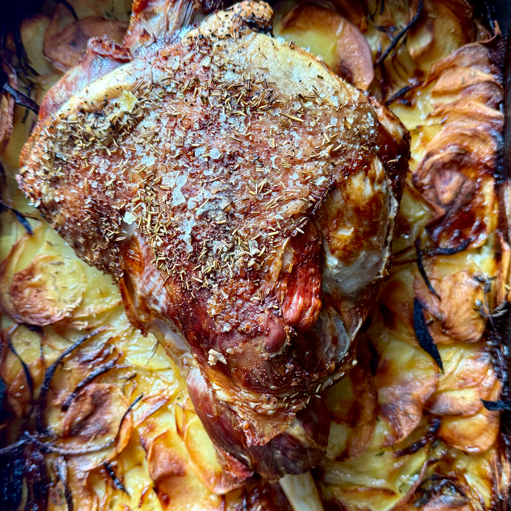 Lamb Leg Roast with Potato Lyonnaise and an Anchovy & Herb Butter by Matt Burgess