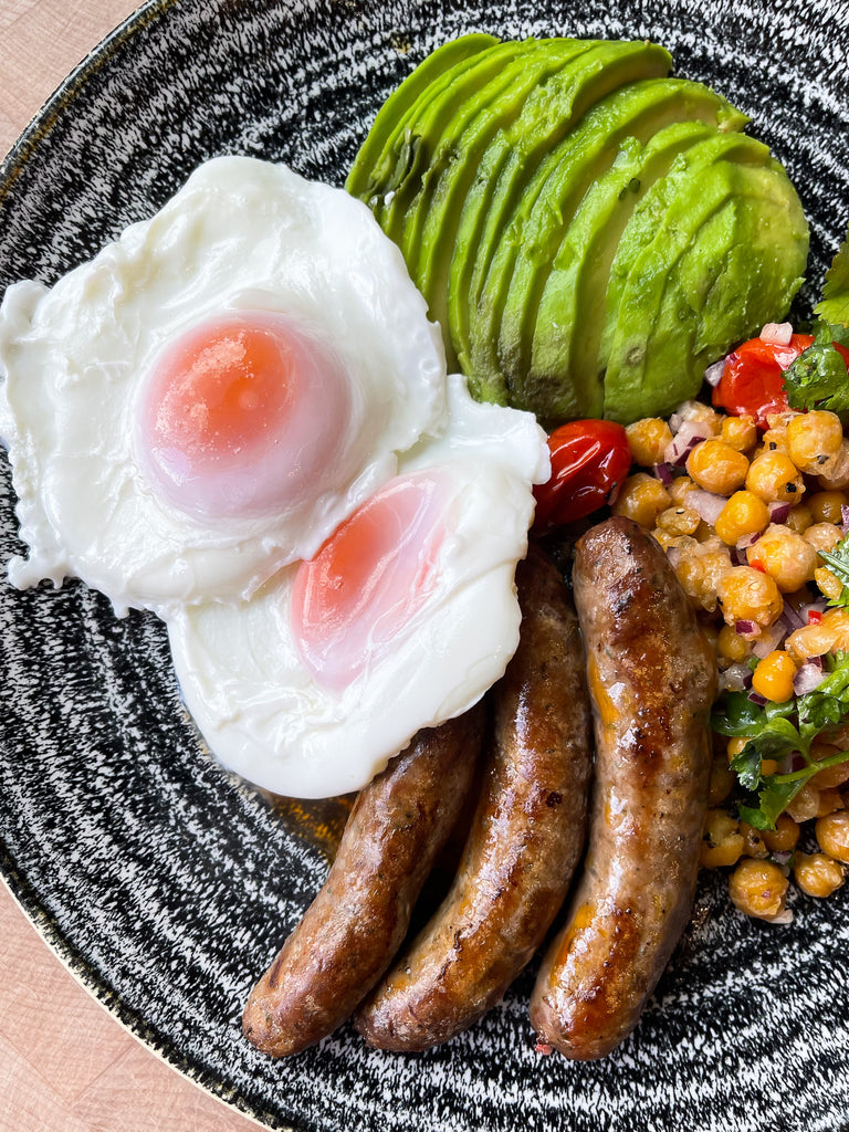 Beef sausage with chickpea salad, avocado & poached eggs by Barry Horne