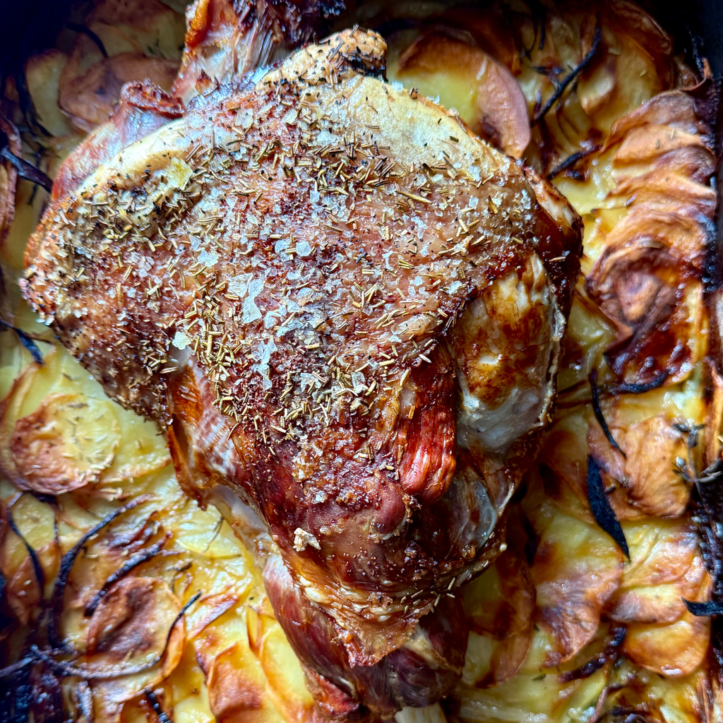 Lamb roast with potato lyonnaise and an anchovy and herb butter by Matt Burgess